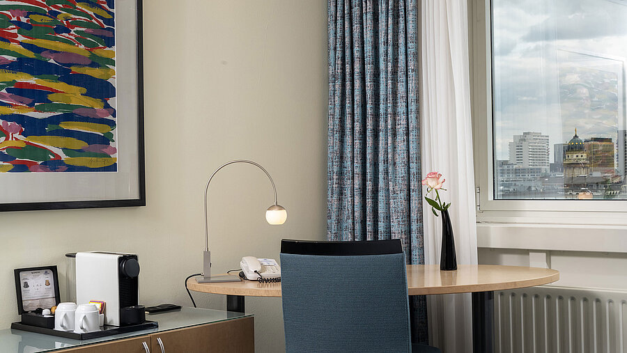 Desk with coffee machine and window view in Superior room of Maritim proArte Hotel Berlin