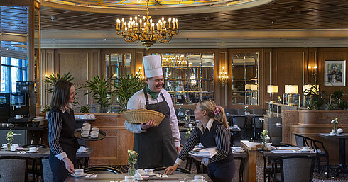  Service team and chef at Maritim Hotel Hannover preparing the restaurant.