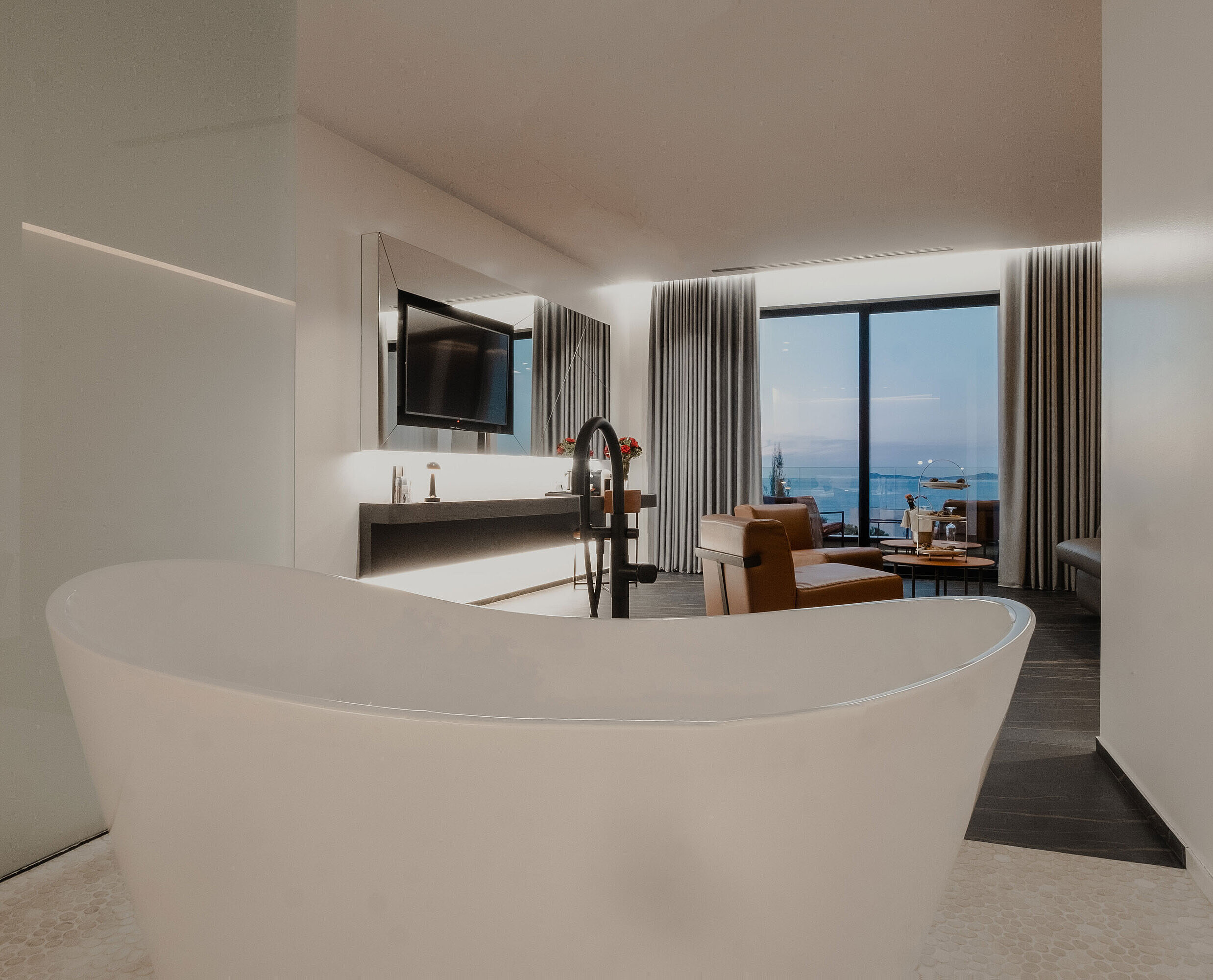 Modern suite at Maritim Resort Marina Bay with freestanding bathtub, elegant design and sea view