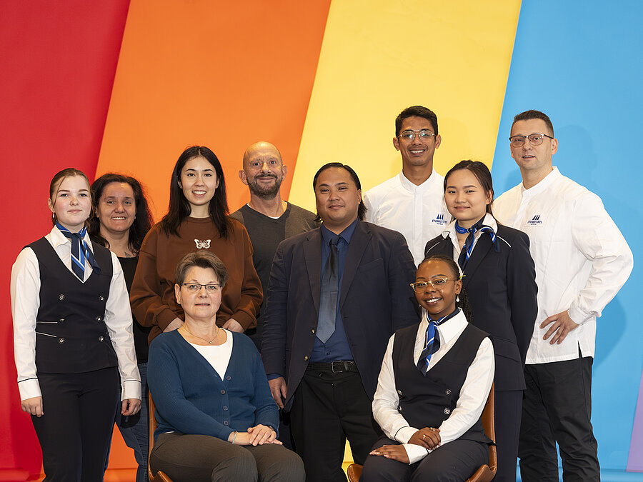Maritim Hotels employees standing together representing diversity, team spirit and career opportunities