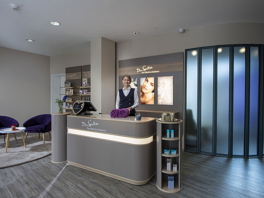 Friendly staff at the spa reception of Maritim Hotel Titisee with Dr. Spiller products