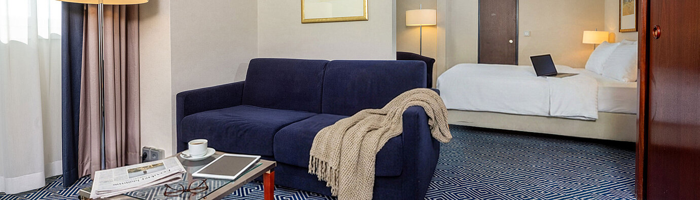 Classic Family room Classic Family room at Maritim Hotel Würzburg with sofa bed, double bed and stylish interior