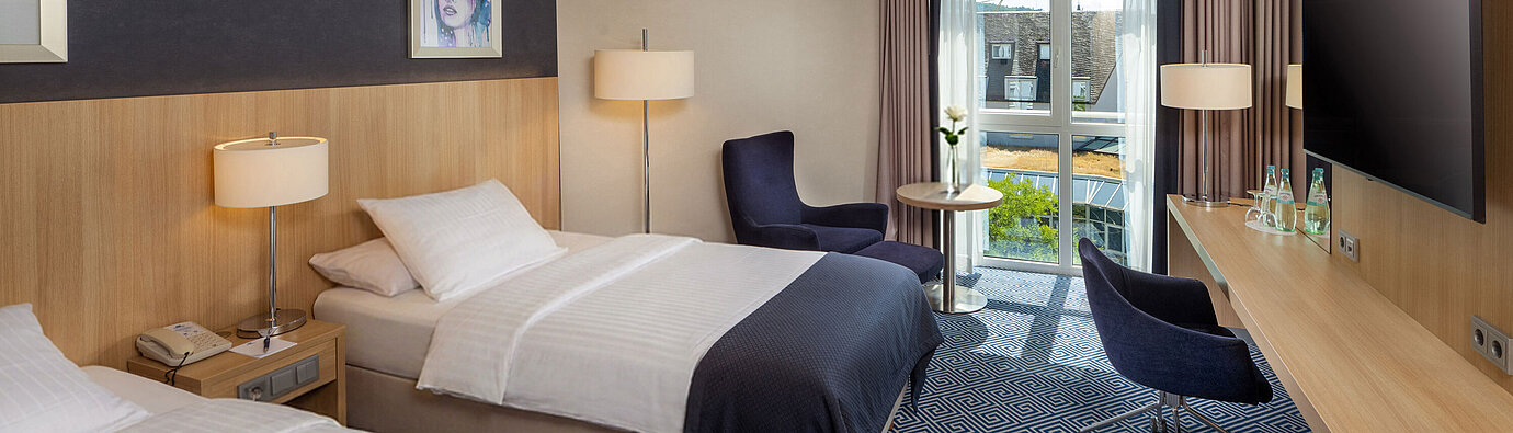Comfort Twin room Comfort Twin room at Maritim Hotel Würzburg with two single beds, balcony and modern comfort