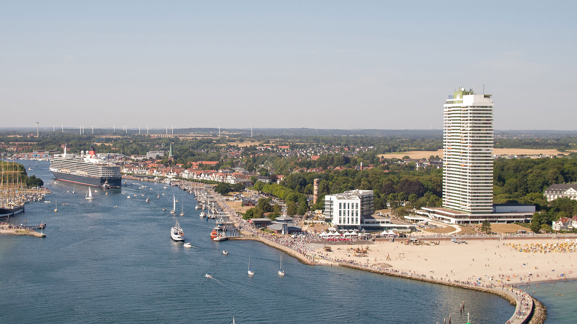 Aerial view of Travemünde with cruise ship, promenade and Maritim Hotel by the Baltic Sea