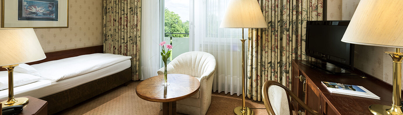 Single room with balcony and green view at Maritim Hotel Bad Wildungen