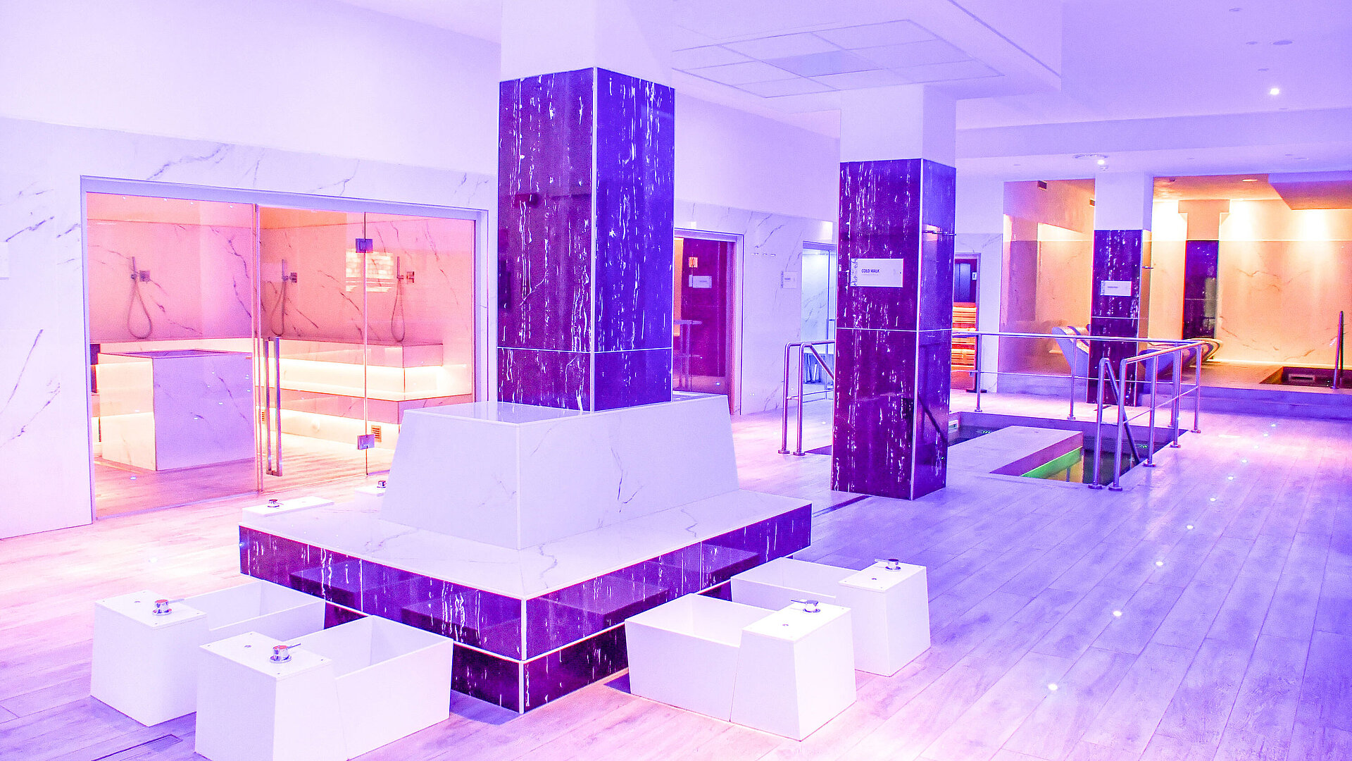 Modern spa area with foot baths, saunas and stylish lighting at Maritim Resort Calabria