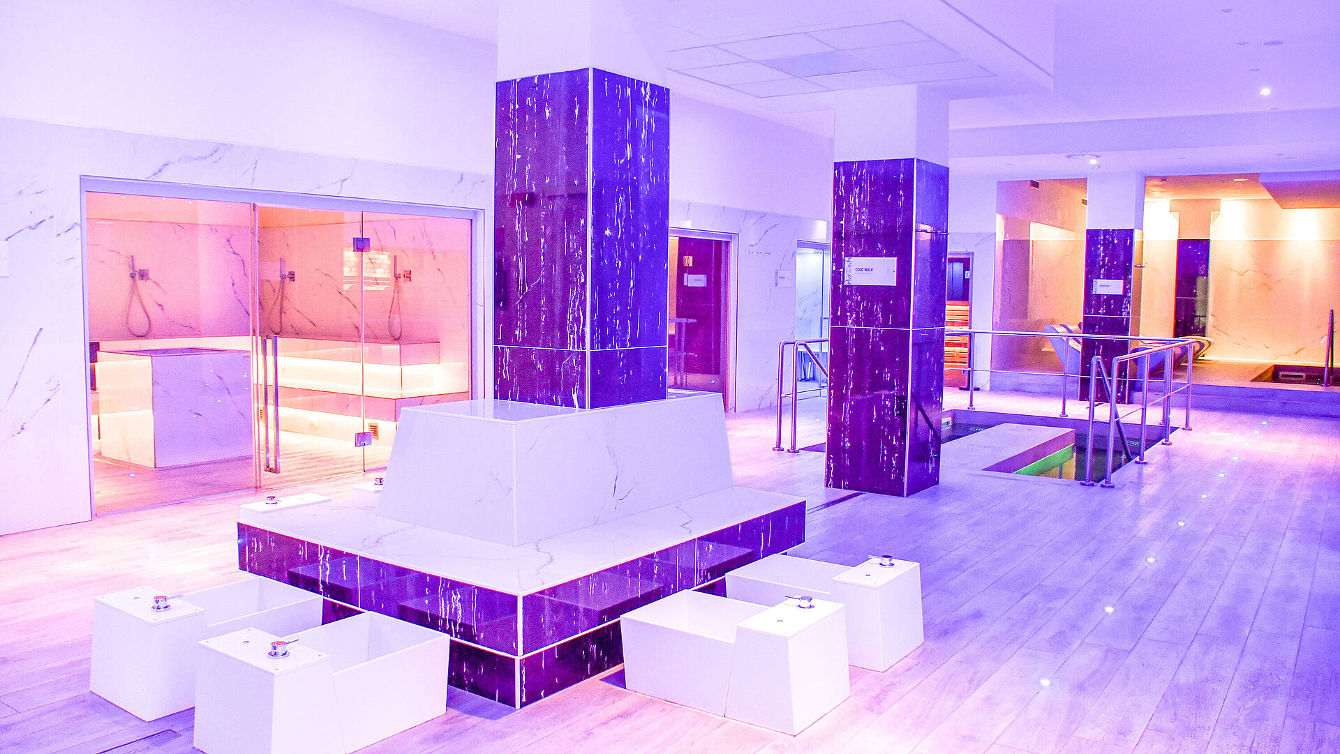 Modern spa area with foot baths, saunas and stylish lighting at Maritim Resort Calabria