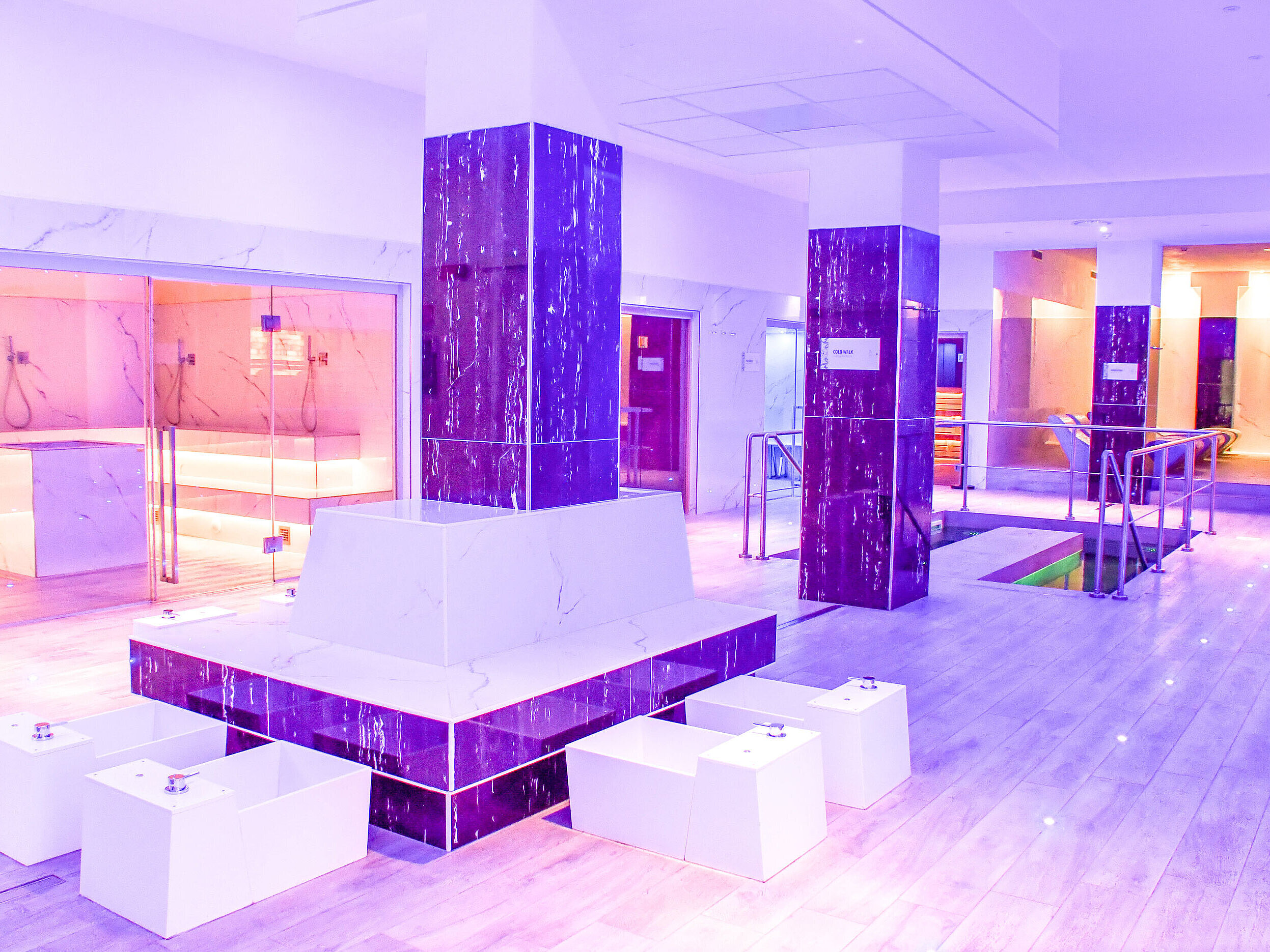 Modern spa area with foot baths, saunas and stylish lighting at Maritim Resort Calabria