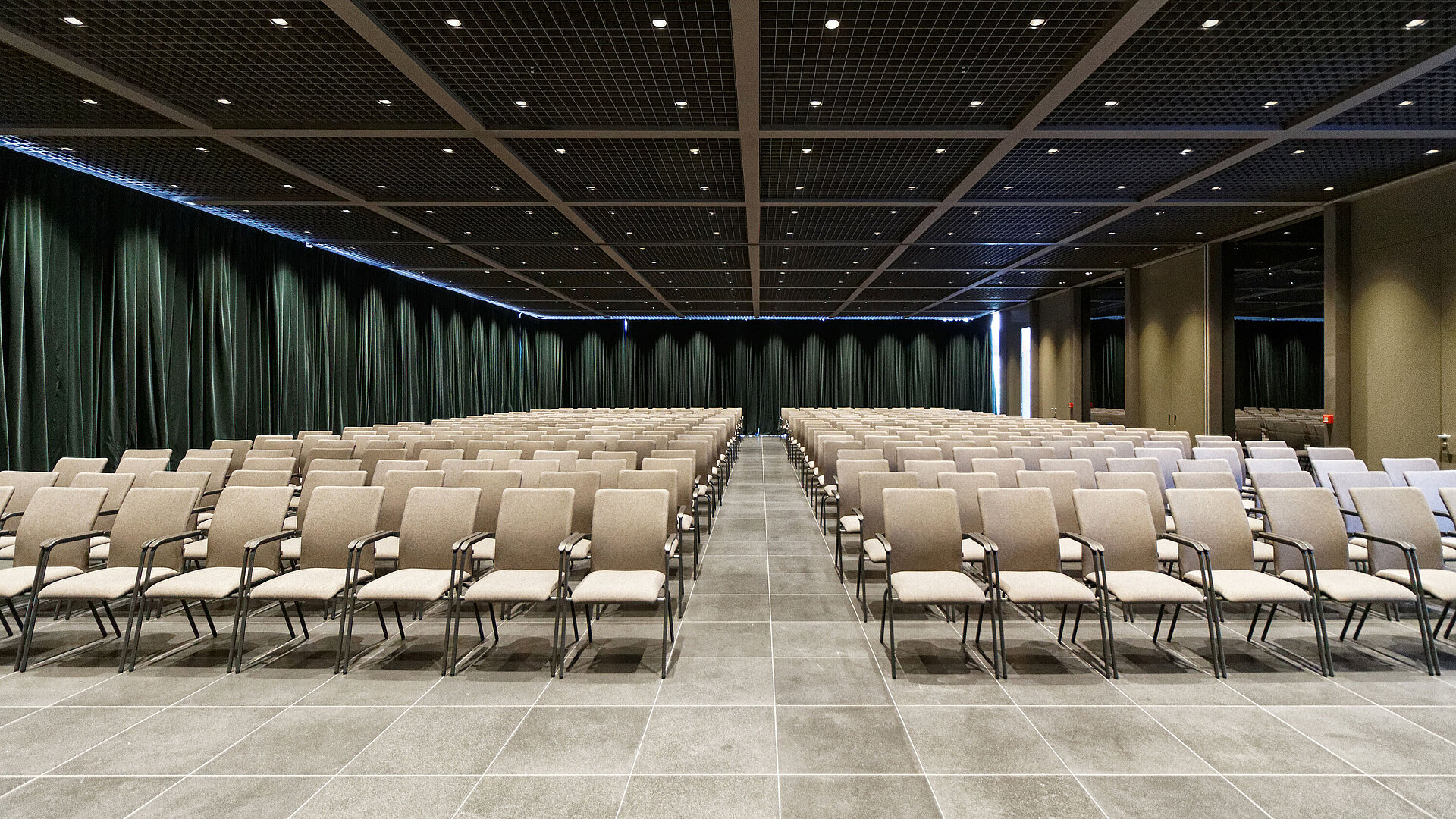 Large conference hall with row seating and stage view at Maritim Hotel Plaza Tirana