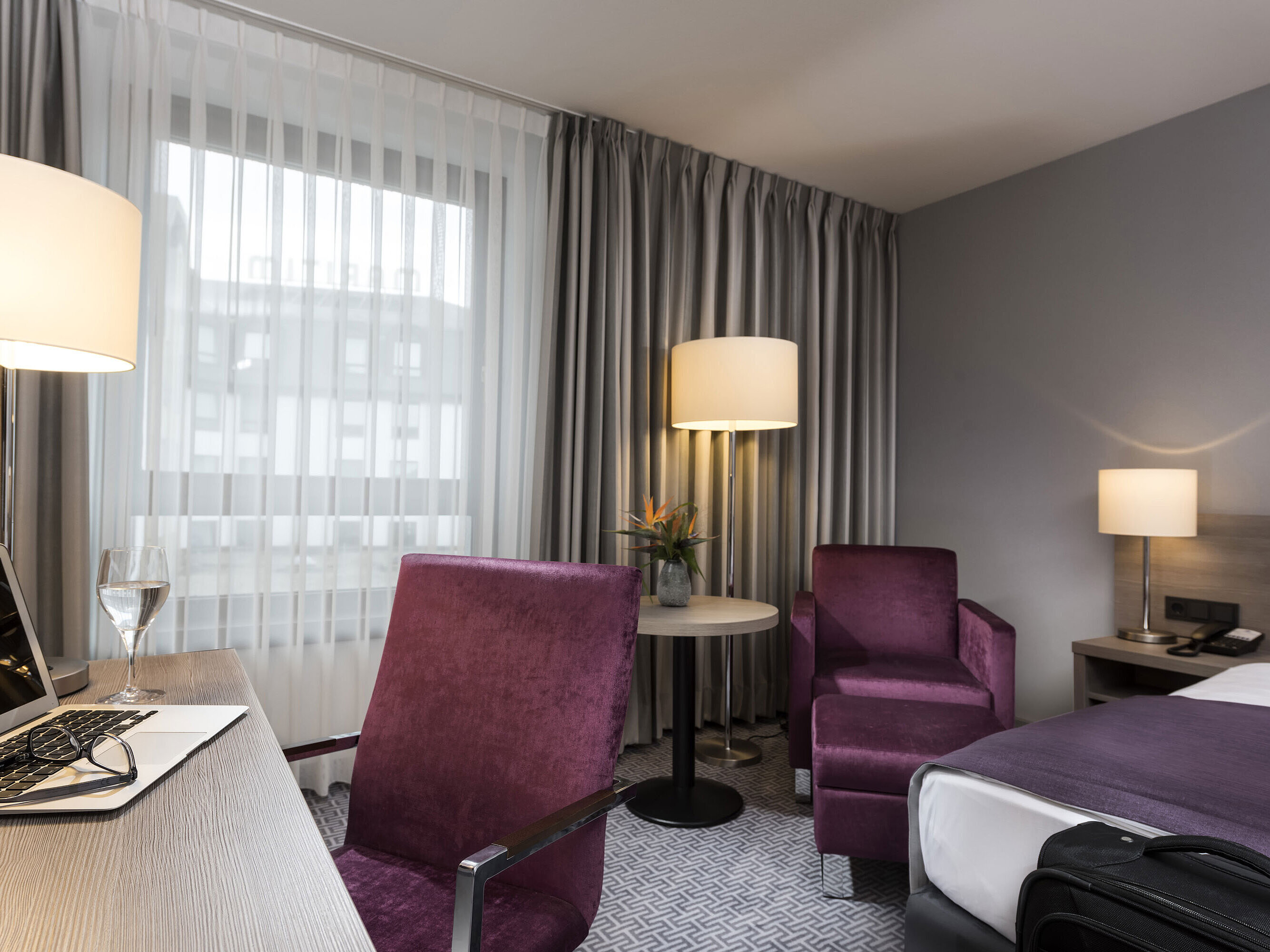 Stylish single room at Maritim Hotel Königswinter with desk, armchair, and modern design.