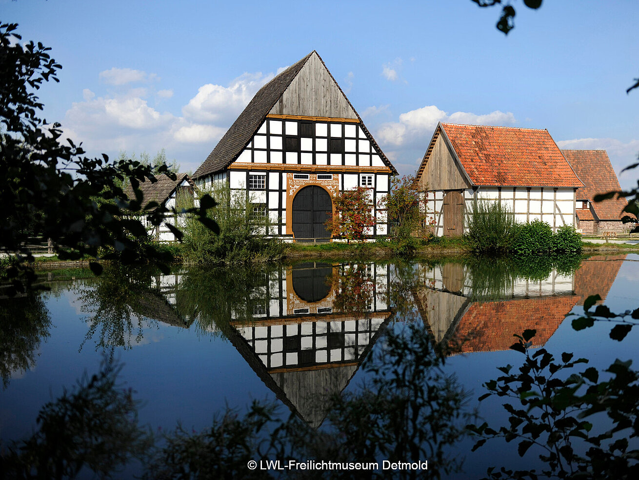 Historic half-timbered houses at LWL open-air museum in Detmold by a pond