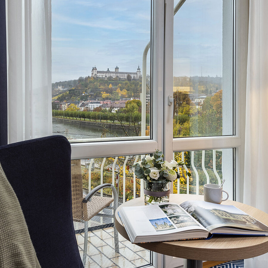 Comfortable Superior Room at Maritim Hotel Würzburg with a panoramic view of Marienberg Fortress