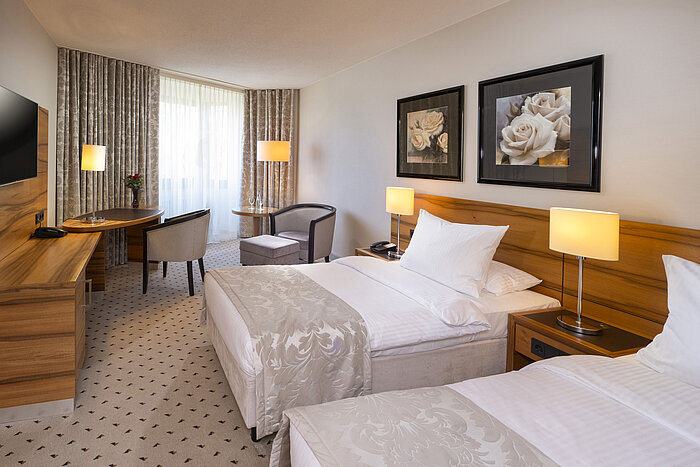 Comfortable double room at Maritim Hotel Bad Homburg with bright decor and cozy atmosphere.