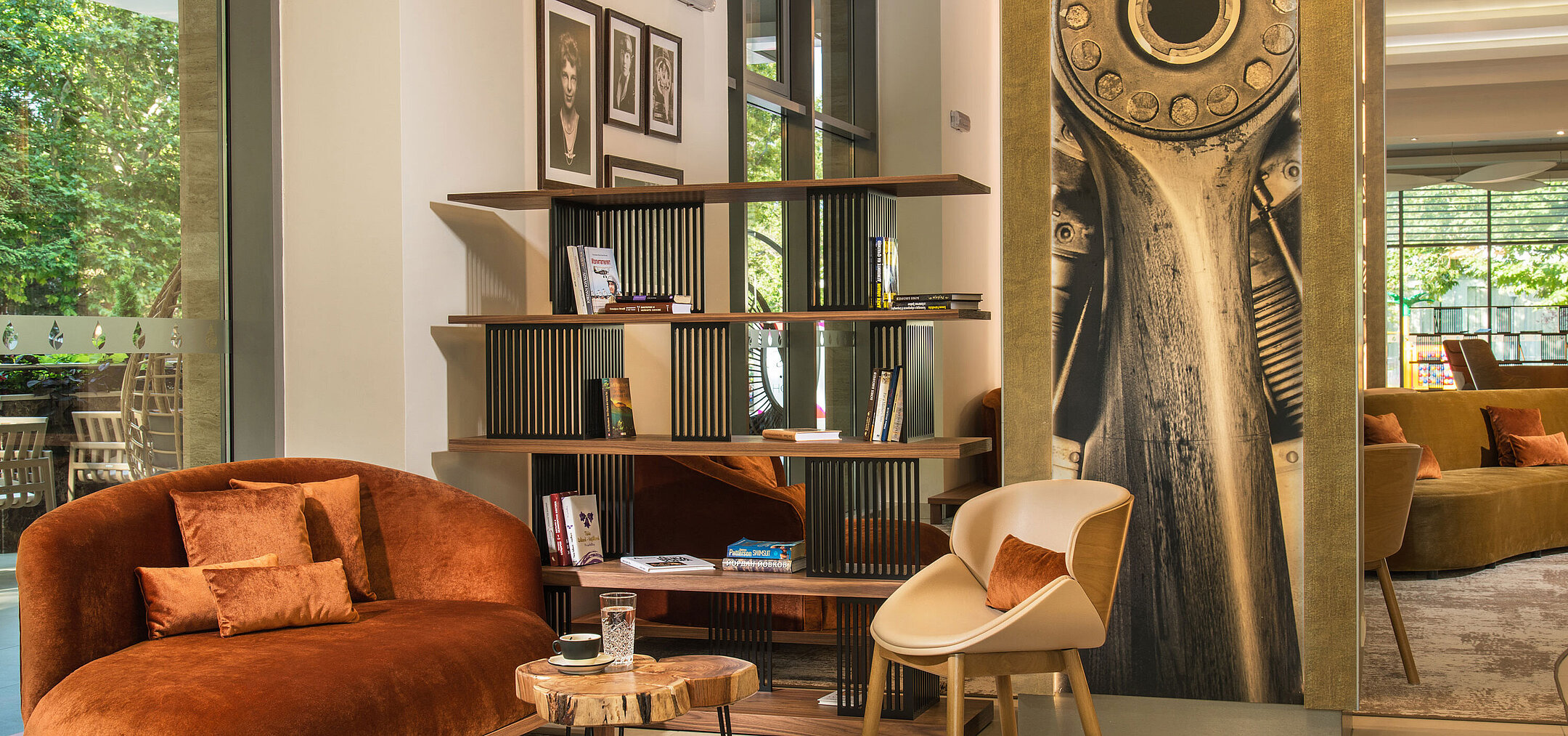 Elegant lounge at Maritim Hotel Amelia featuring cosy seating, bookshelf and stylish design