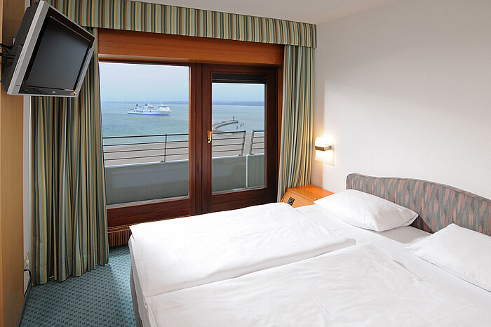 Double room with sea view and passing ferry at Maritim Hotel Travemünde