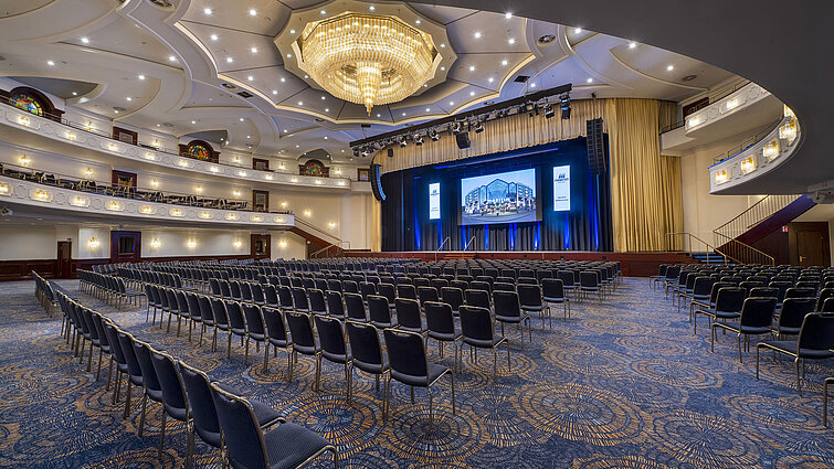 Spacious Maritim Hall at Maritim Hotel Cologne, ideal for large events and conferences, with luxurious lighting and seating.