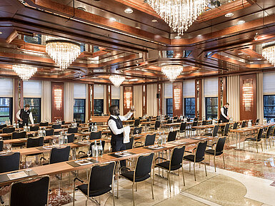 Reger Hall at Maritim Hotel Bonn, with elegant lighting and row seating, perfect for events and conferences.