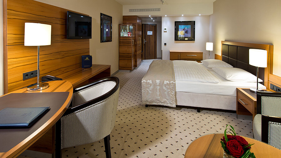 Comfortable Classic room at Maritim Hotel Bad Homburg with modern design and desk.