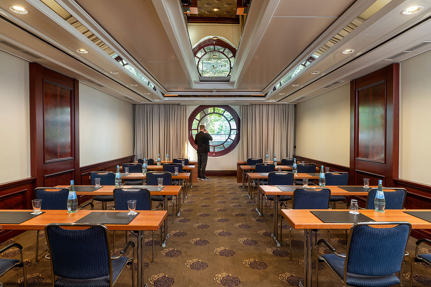Meeting room at Maritim Hotel Köln with large round window and conference seating