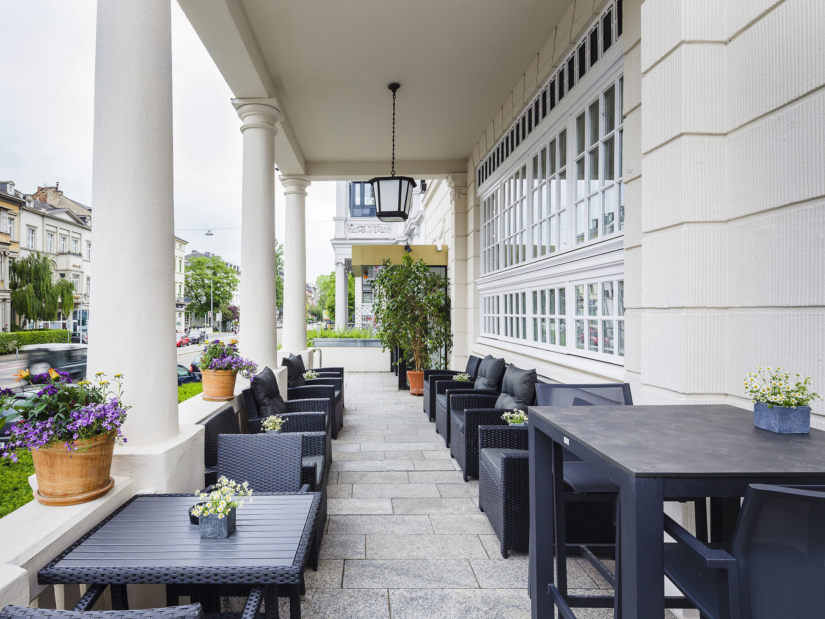 Terrace of Hansa Hotel Wiesbaden with seating and columns