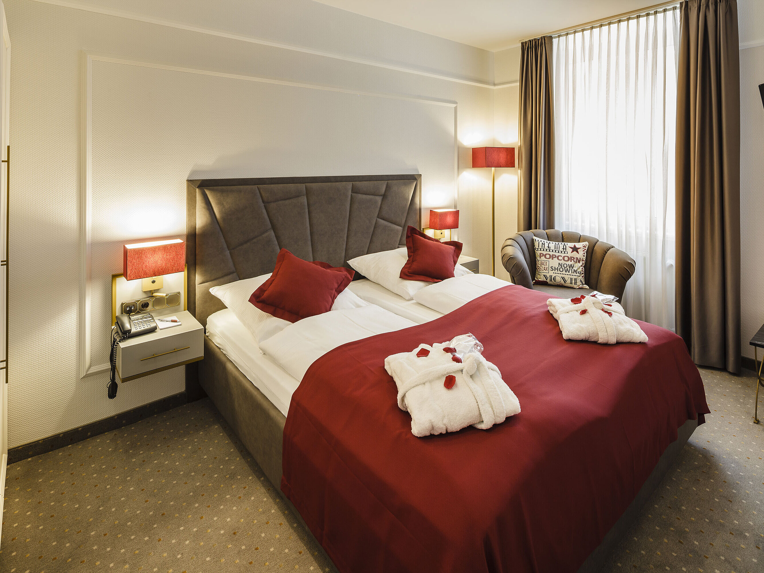 Comfortable double room with bathrobes and cosy lighting at Hansa Hotel Wiesbaden